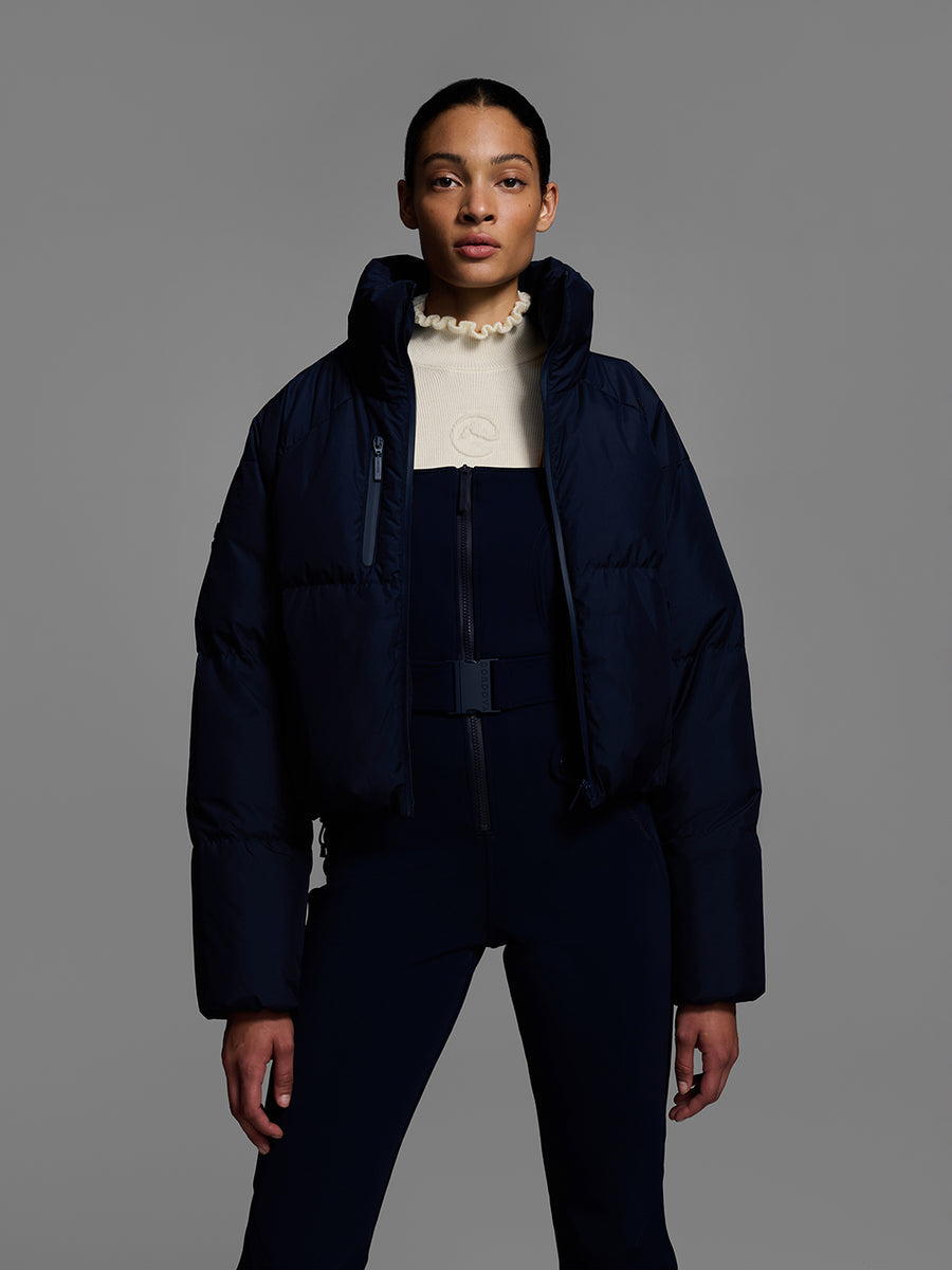 26 Cordova - Women's Fernie Bib Pants Indigo, styled with Cortina ski jacket