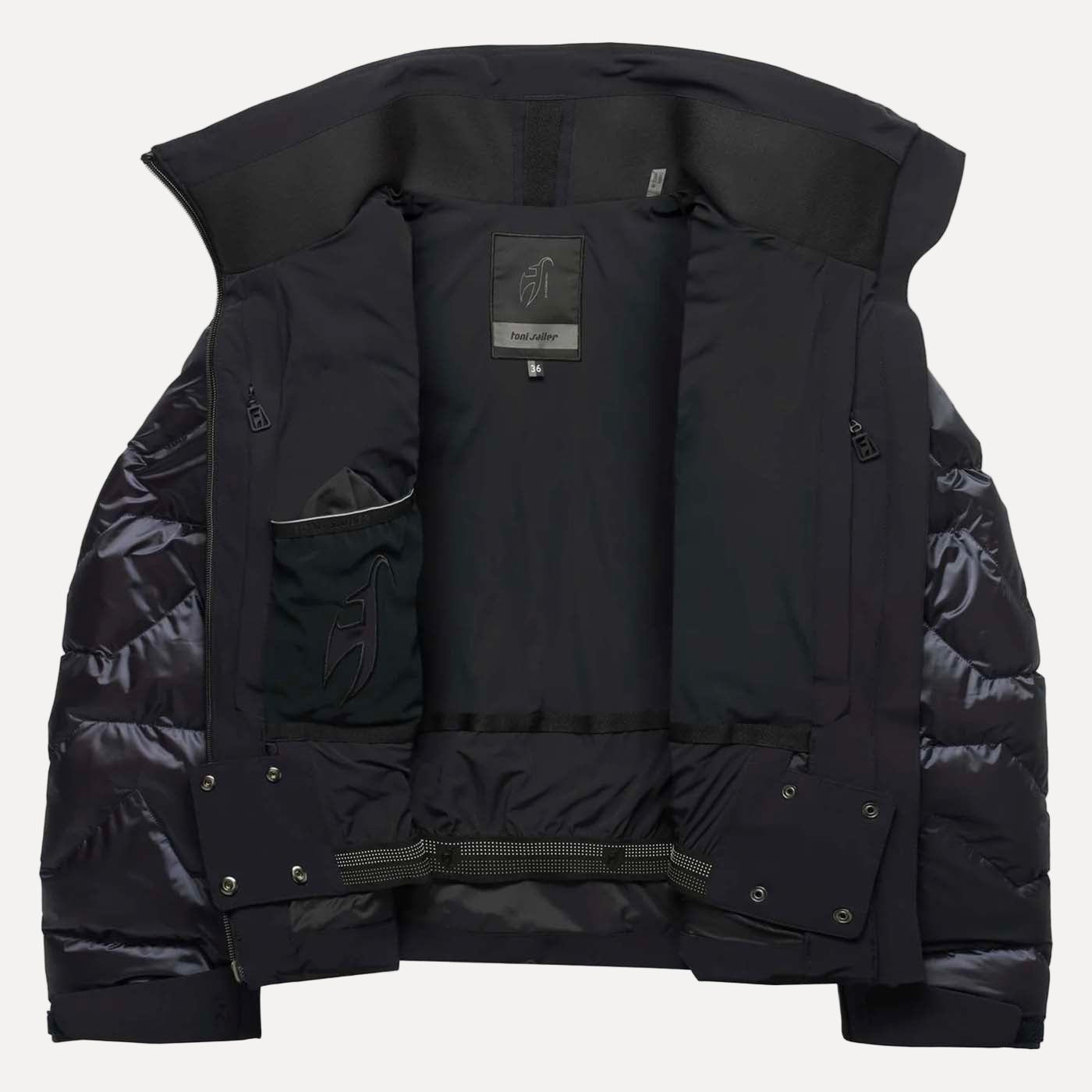 Black puffer jacket with brand label on a white background